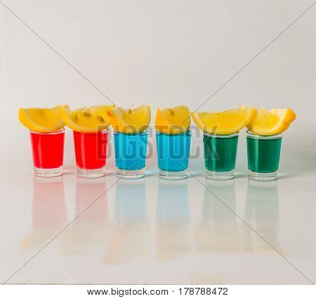 Glasses With Blue, Green And Red Kamikaze, Glamorous Drinks, Mixed Drink Poured Into Shot Glasses