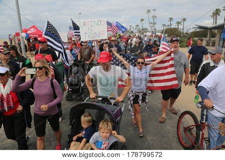 Huntington Beach, CA - March 25 2017: Make America Great Again March. Thousands of Supporters of republican president Donald Trump, wave flags, signs and march at a MAGA March in Huntington Beach. 

