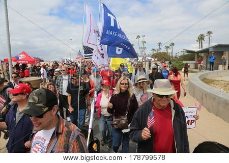 Huntington Beach, CA - March 25 2017: Make America Great Again March. Thousands of Supporters of republican president Donald Trump, wave flags, signs and march at a MAGA March in Huntington Beach. 

