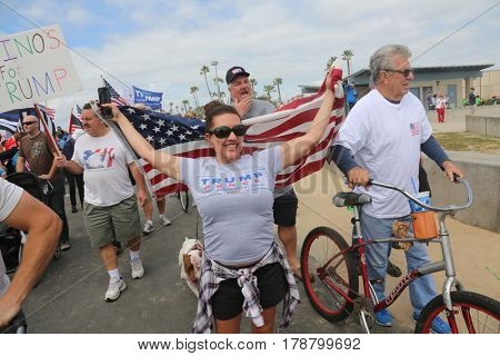 Huntington Beach, CA - March 25 2017: Make America Great Again March. Thousands of Supporters of republican president Donald Trump, wave flags, signs and march at a MAGA March in Huntington Beach. 

