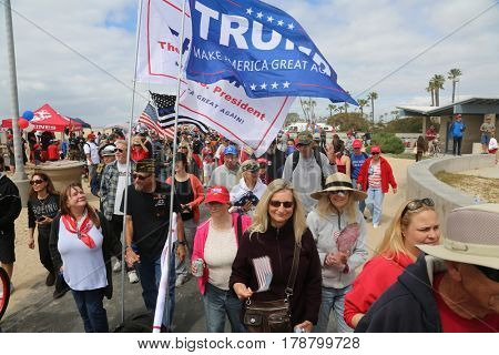 Huntington Beach, CA - March 25 2017: Make America Great Again March. Thousands of Supporters of republican president Donald Trump, wave flags, signs and march at a MAGA March in Huntington Beach. 

