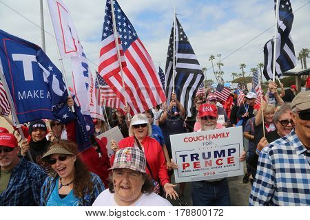 Huntington Beach, CA - March 25 2017: Make America Great Again March. Thousand of Supporters of republican president Donald Trump, march and wave flags, at a MAGA March in Huntington Beach. 



