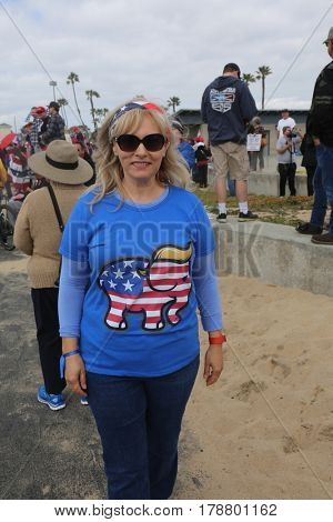 Huntington Beach, CA - March 25 2017: Make America Great Again March. Thousand of Supporters of republican president Donald Trump, march and wave flags, at a MAGA March in Huntington Beach. 




