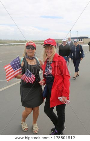 Huntington Beach, CA - March 25 2017: Make America Great Again March. Thousand of Supporters of republican president Donald Trump, wear T-Shirts march and wave flags, at a MAGA March. 




