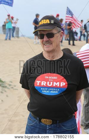 Huntington Beach, CA - March 25 2017: Make America Great Again March. Thousand of Supporters of republican president Donald Trump, march and wave flags, at a MAGA March in Huntington Beach. 




