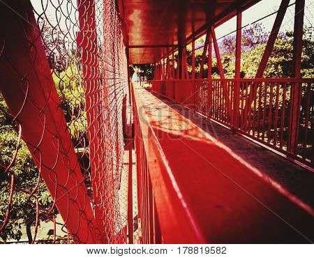 Way of a red structure of a peatonal bridge