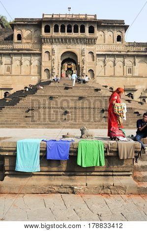 People Walking In Front Of Maheshwar Palace On India