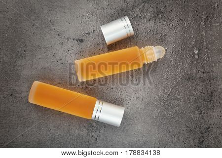 Bottles with perfume on grunge background