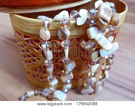 Beads made of natural stone in a casket from birch bark. Closeup. Ural gems. Ural, Russia