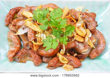 Pork chitterlings, fried garlic, pepper on the plate