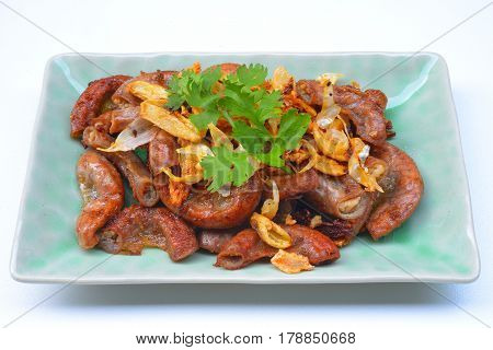 Pork chitterlings, fried garlic, pepper on the plate
