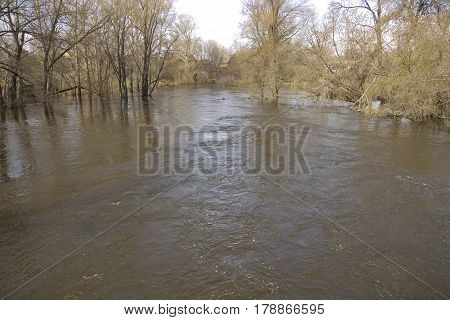 Spring flood in the village river overflow
