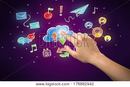 Female hand toucing mixed media icons with purple background