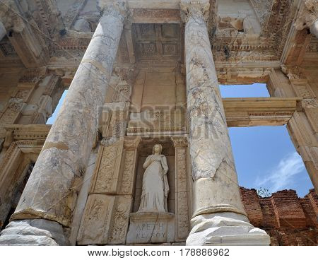 Library of Celsus is an ancient Roman building in Ephesus (Turkey). Woman's sculpture between two columns in the middle of composition.