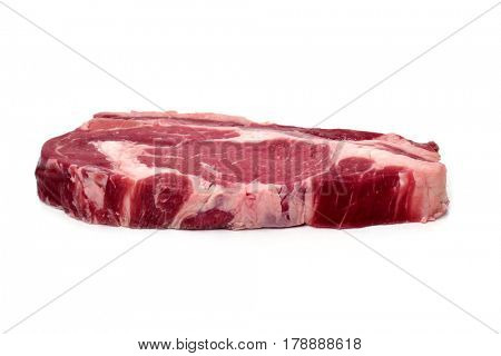closeup of raw strip steak on a white background