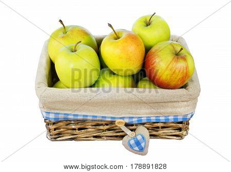 Colored Apples in a wicker basket isolated on white background