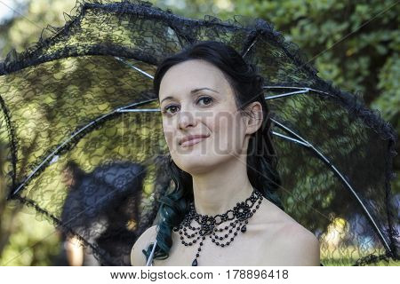CAGLIARI, ITALY - May 29, 2016: Sunday at La Grande Jatte VIII Ed. At the Public Gardens - portrait of a beautiful woman in Victorian costumes - Sardinia