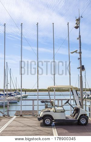 Electric golf cart parked at El Rompido Marina Huelva Spain
