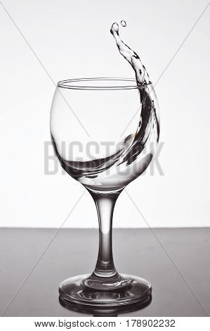 a glass of water on white background.a glass of freezing water