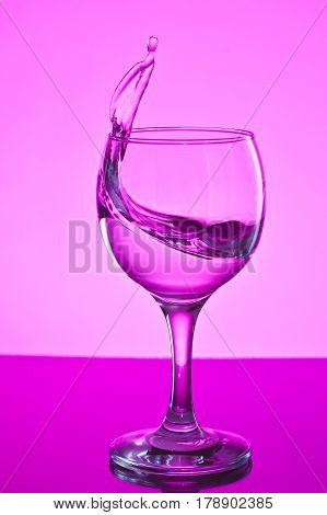 a glass of water on white background.a glass of freezing water