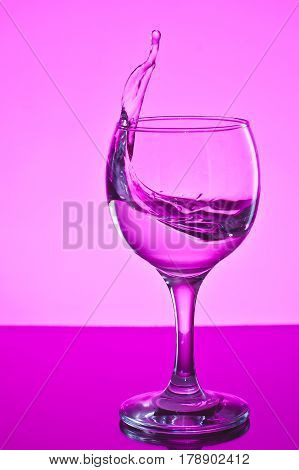a glass of water on white background.a glass of freezing water