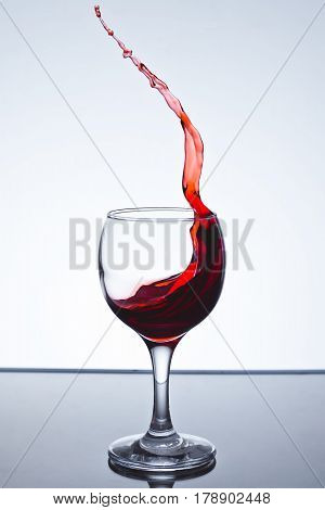 Red wine splash on a white background freezing
