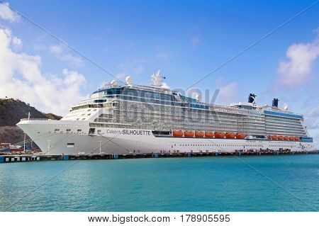 PHILISBURG,ST. MARTEEN - APRIL 16,2015:  Cruise ship Celebrity Silhouette, docked at Philisburg, St. Marteen harbor on a clear sunny day.