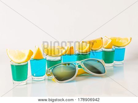 Glasses With Blue And Green Kamikaze, Glamorous Drinks, Mixed Drink Poured Into Shot Glasses, Sungla