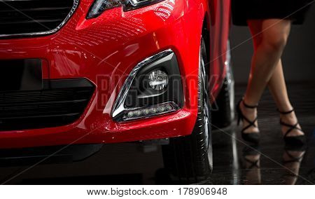 Modern Car With Sexy Woman In Background