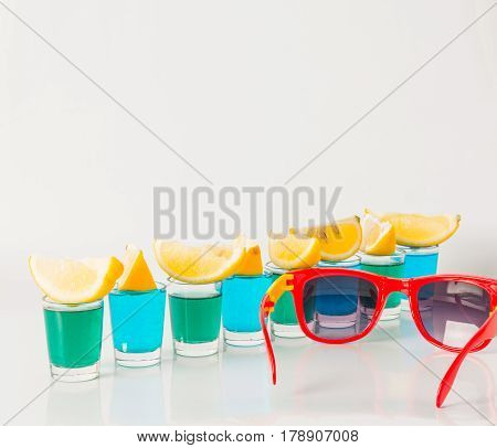 Glasses With Blue And Green Kamikaze, Glamorous Drinks, Mixed Drink Poured Into Shot Glasses, Sungla