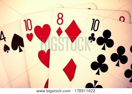 Playing Cards Close Up Detail. Black And Red Cards With A Little Bit Sepia Fiter
