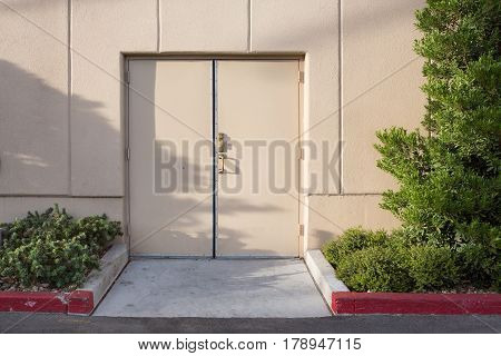 Door with little garden and cement wall lighting shading