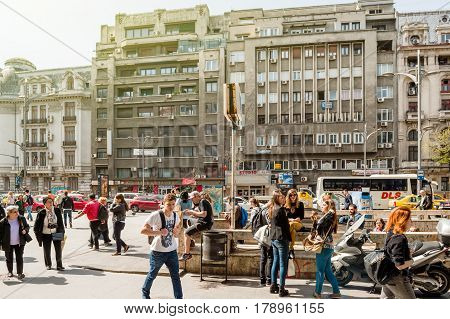 BUCHAREST ROMANIA - APR 1 2016: Pedestrians in the center of Bucharest Bulevardul General Gheorghe Magheru near the metro station entrance
