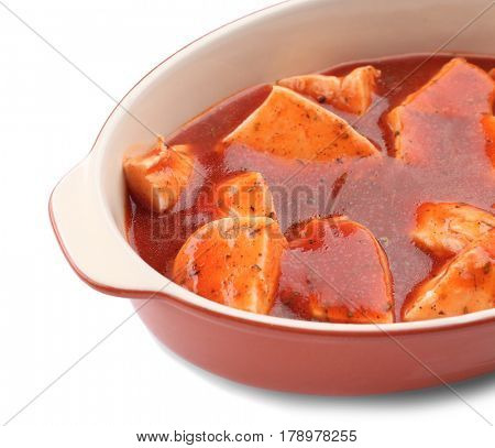 Chicken cacciatore in baking dish isolated on white