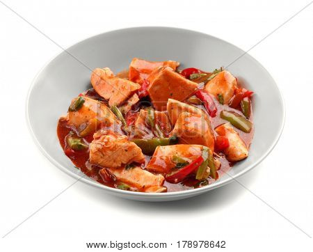 Chicken cacciatore in plate isolated on white