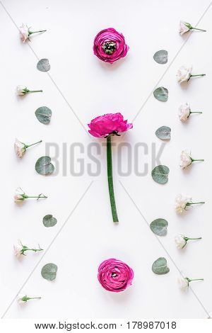 Modern spring design with bright pink flowers on white desk background top view moke up