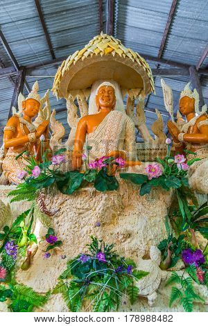 Buddha image with Thai literature goddess made from wax for marhing in candle festival in Ubonratchthani Thailand