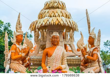 Buddha image with Thai literature goddess made from wax for marhing in candle festival in Ubonratchthani Thailand