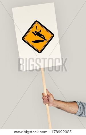 Studio Shoot Holding Banner with Slip Caution Sign 
