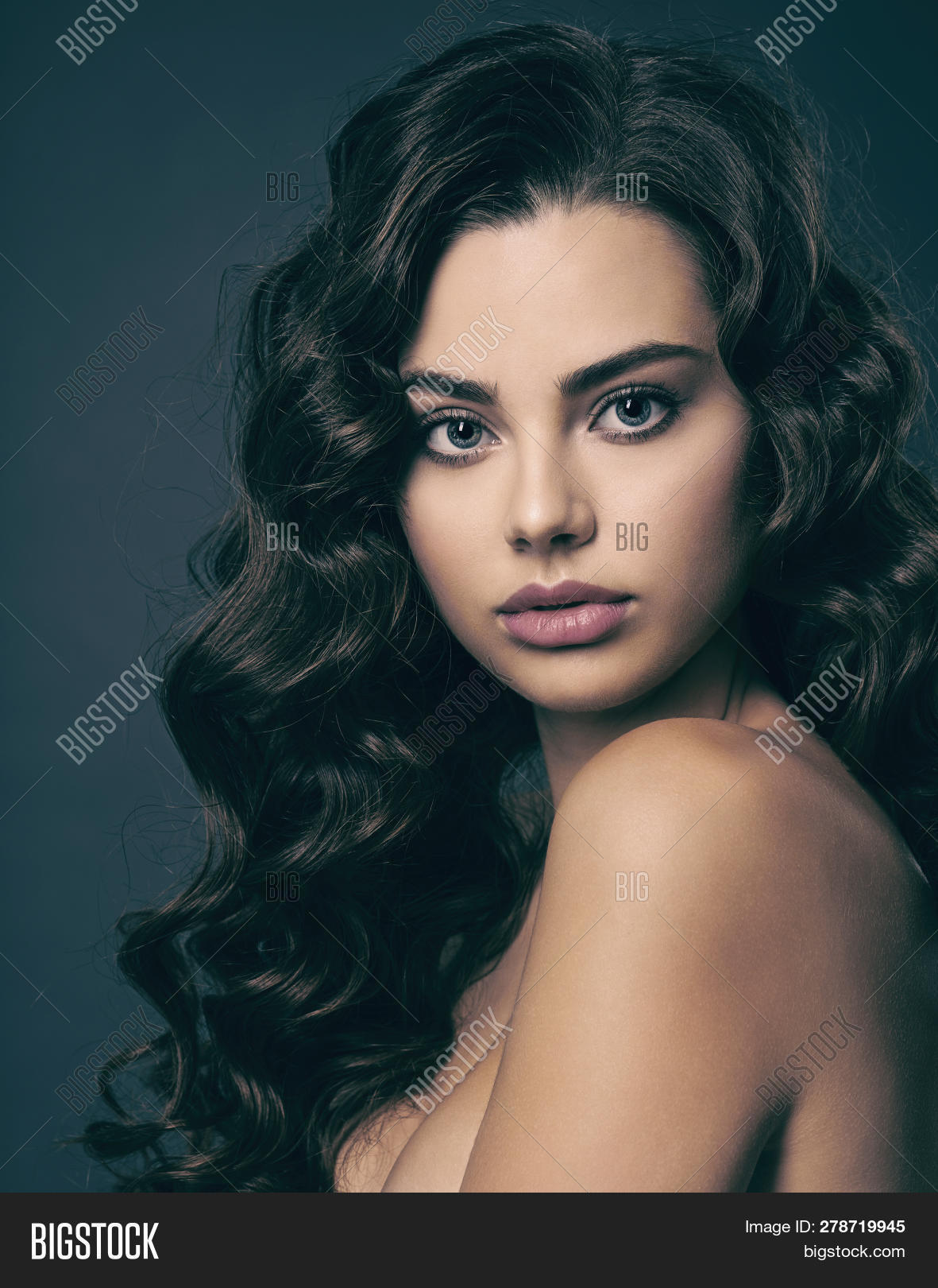 Close-up Portrait of a Beautiful Young Brunette Girl with Big Eyes