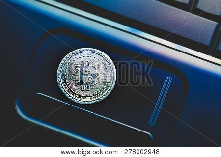 Bitcoin Currency Laying At Black Laptop Background. Selective Focus.for Decor And Ornament.concept C