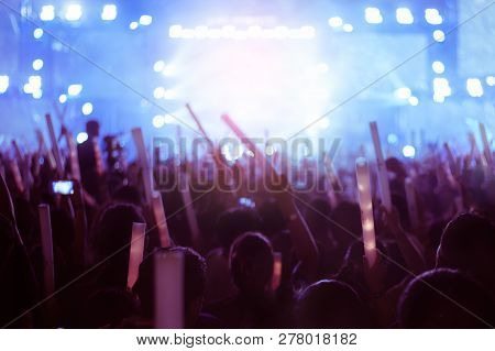 Silhouettes Of Hand In Concert.light From The Stage.