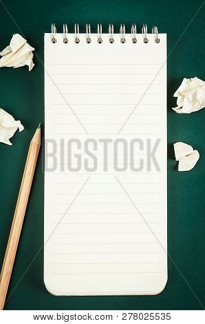 Open Blank Diary Notebook With Wooden Pencil On Green Board For Your Text Or Message.