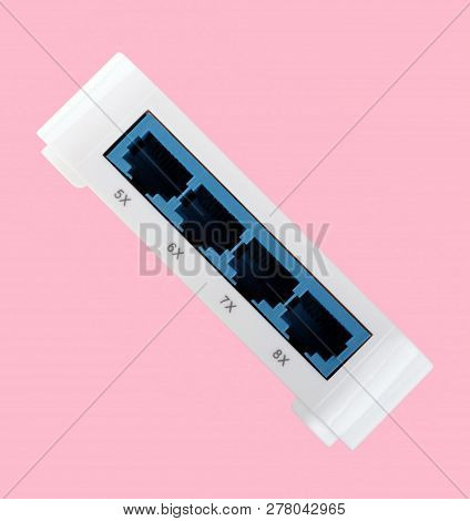 White 8 Port Plastic Ethernet Switch Isolated On Pink Background At Dry Day