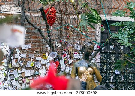 Verona - Italy. January 6, 2019: Statue Of Juliet (symbol Of Love And Romance) And Wall With Love No
