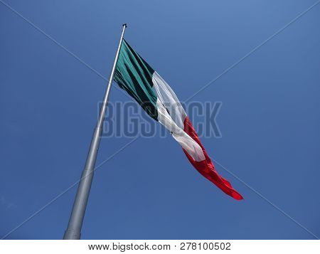 Famous National Maxican Flag On Beach At Bay Of Pacific Ocean In Acapulco City In Mexico With Trees 