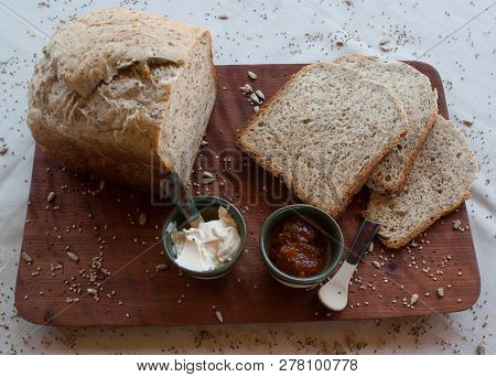 A Tasty And Healthy Breakfast In A Wooden Table Over A White Background