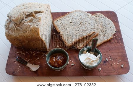 A Tasty And Healthy Breakfast In A Wooden Table Over A White Background