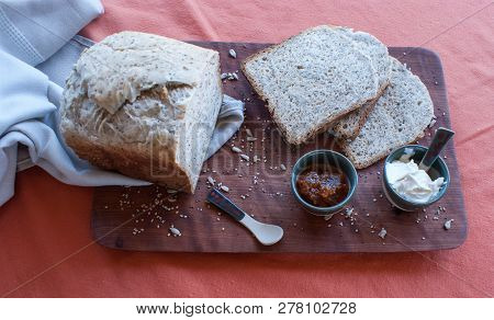 A Tasty And Healthy Breakfast In A Wooden Table Over A Brown Background