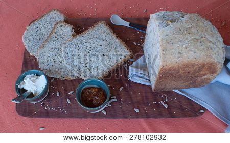 A Tasty And Healthy Breakfast In A Wooden Table Over A Brown Background